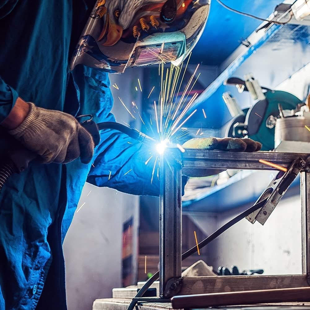 Welder using MB-15AK MIG torch, sparks flying